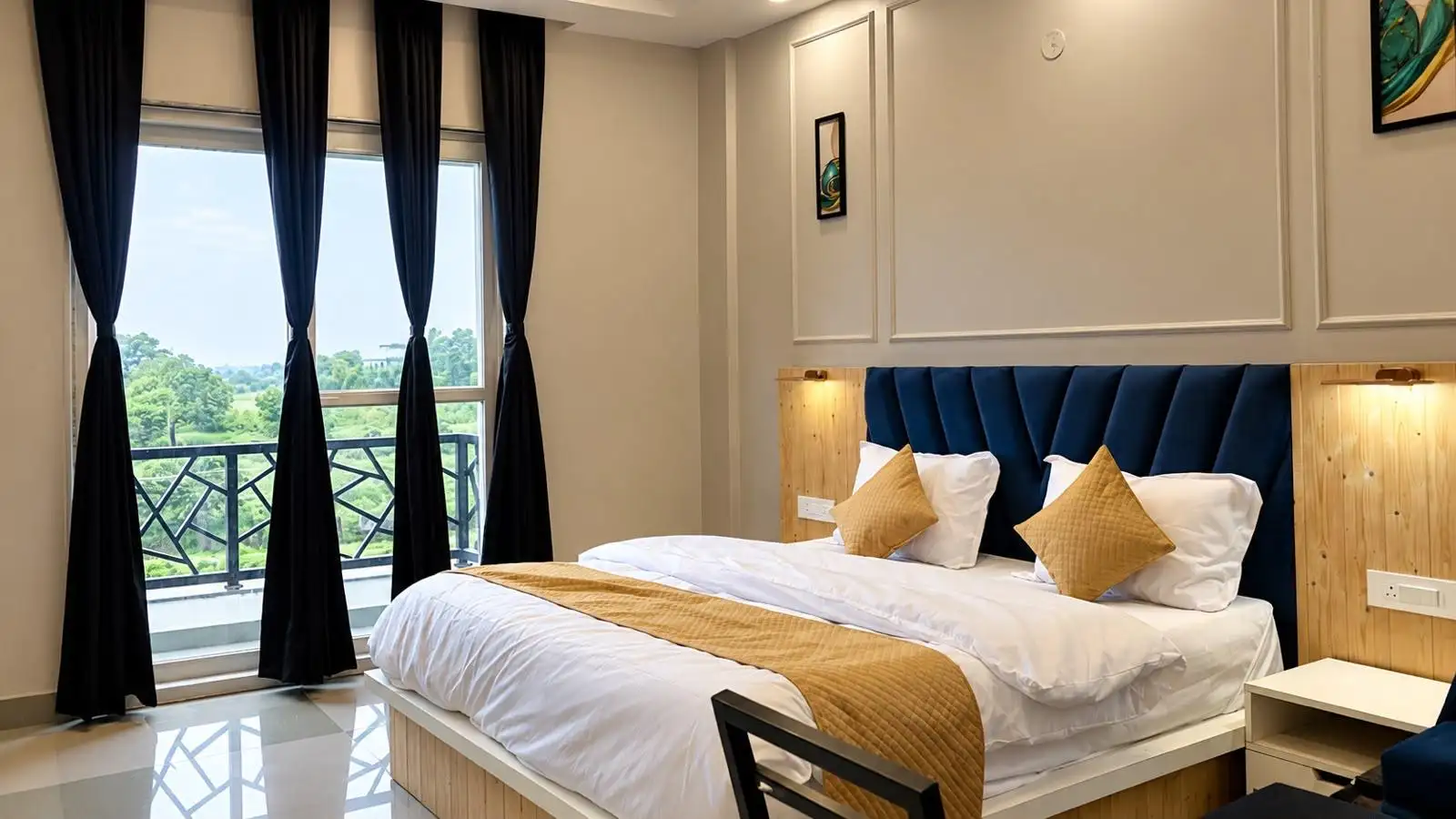 Double-bed room with tall windows onto the balcony