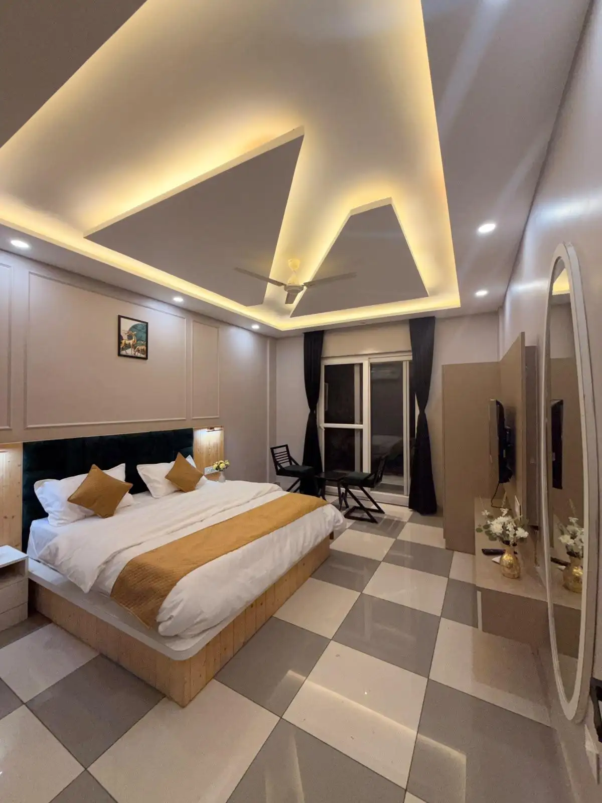 Spacious double-bed room with a lit ceiling
